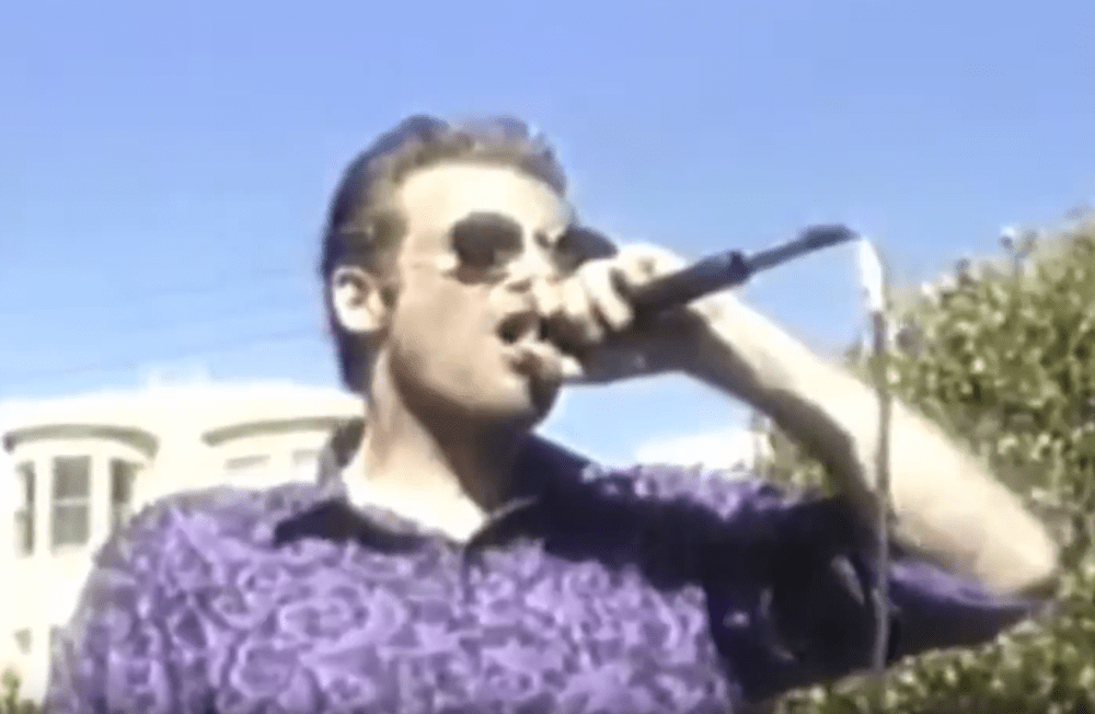 Bruce from Flipper on stage holding the mic at The 1994 Making Waves Festival May 27th 1994
